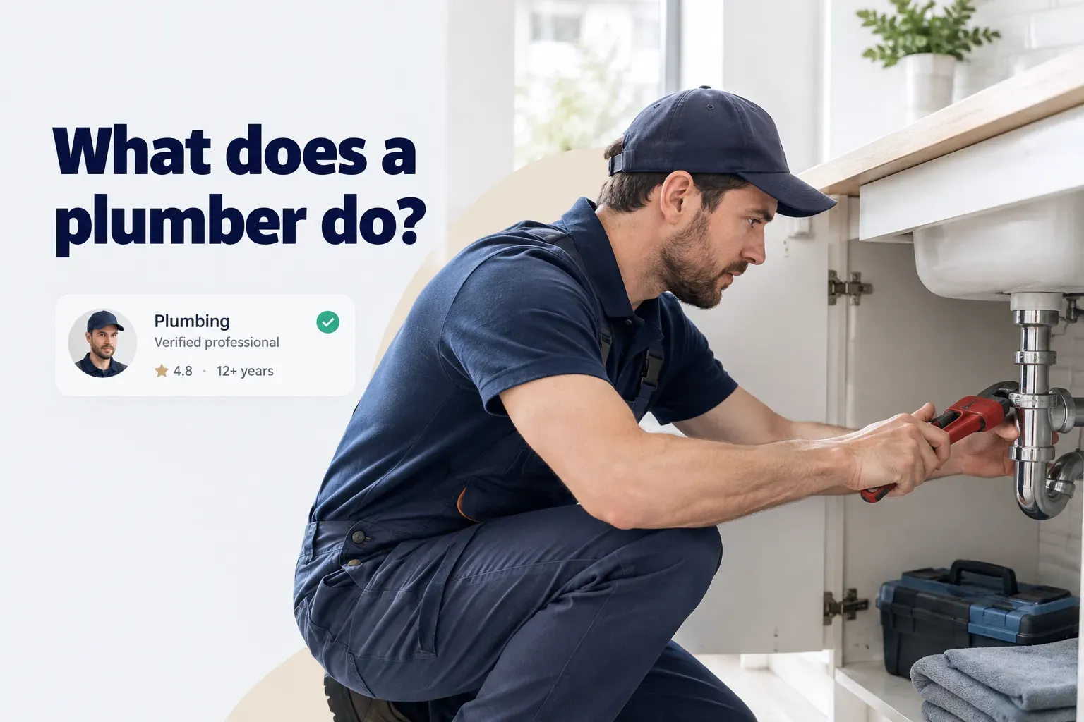 Plumber repairing pipes under a sink, showing what a plumber does during a typical home repair job